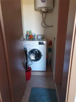 a washer and dryer in a small room at Апартамент в Oasis beach Kamchia - Лунна пътека in Dolen Bliznak