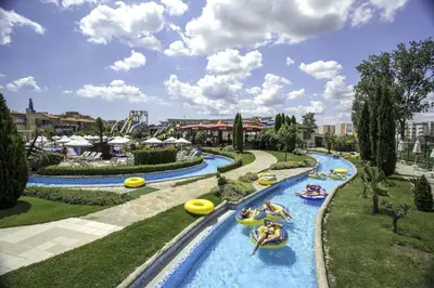 a group of people tubing down a lazy river at Apart hotel Gallery B in Sunny Beach