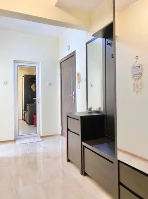 a bathroom with a sink and a mirror at Alonia - your Burgas shelter by the park and beach in Burgas City