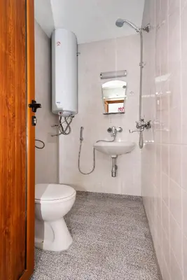 a bathroom with a toilet and a sink at Royal Blue Apartments with Sea View in Old Nessebar in Nesebar