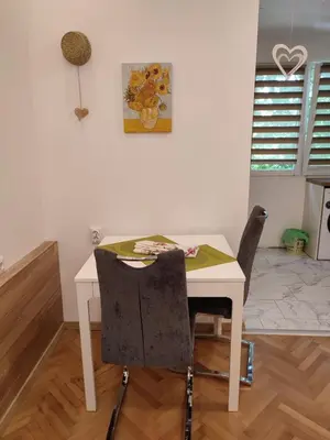 a white table and two chairs in a room at Desafinado in Burgas City