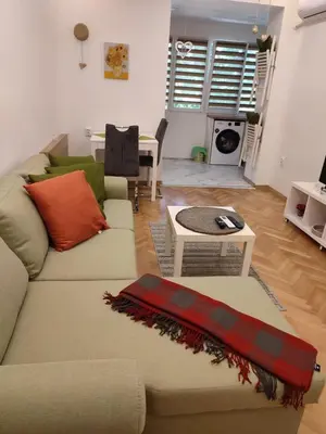 a living room with a couch and a table at Desafinado in Burgas City