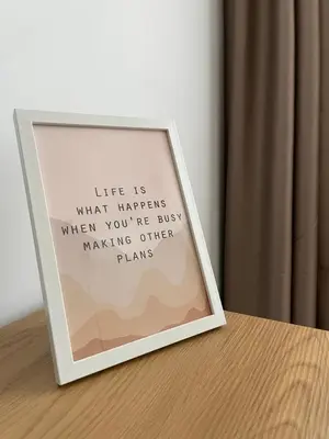 a picture frame sitting on top of a table at Vanquish Central Apartment in Varna City