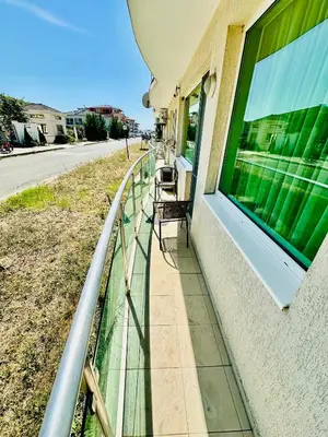 a balcony with chairs on the side of a building at Coastal Vibes Studio Burgas by Flat Mаnаger in Burgas City