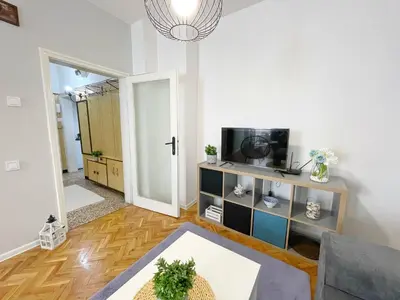 a living room with a couch and a tv at Holiday Home in Burgas City