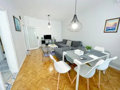 a living room with a table and chairs and a couch at Holiday Home in Burgas City