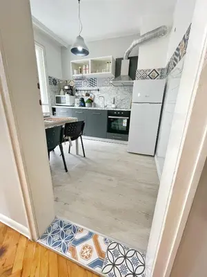 a kitchen and dining room with a tile floor at Holiday Home in Burgas City
