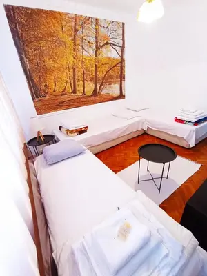a room with two beds and a table in it at Holiday Home in Burgas City