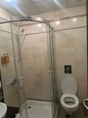 a bathroom with a shower with a toilet and a sink at Oazis VIP Club in Sunny Beach