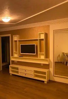 a living room with a tv on a wall at Penthouse Happy Moments 3 in Sunny Beach