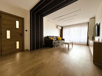 a living room with a couch and a table at Apartment 122 in Burgas City