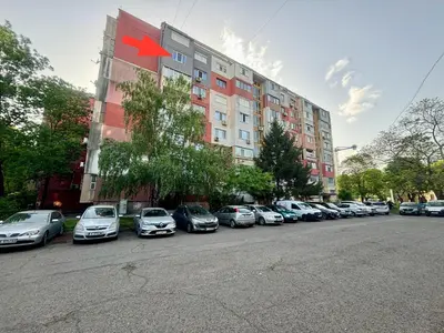 a row of cars parked in front of a building at Apartment 122 in Burgas City