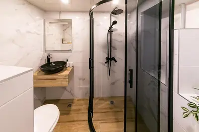 a bathroom with a shower and a sink at ToP center of Varna in Varna City