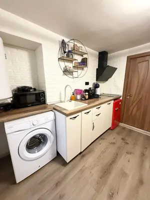 a kitchen with a washing machine and a sink at ToP center of Varna in Varna City