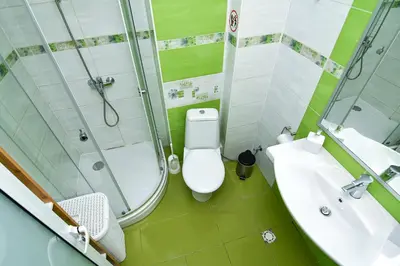 a bathroom with a shower and a toilet and a sink at Central Paradise - free parking in Varna City
