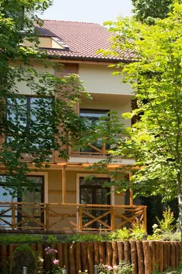 a house with a fence in front of it at Holiday Village Lozenets in Lozenets