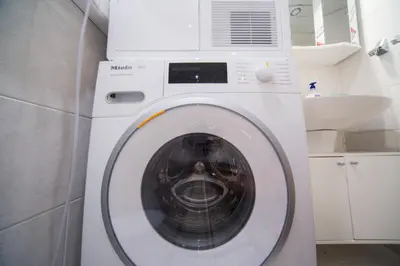 a white washer and dryer in a kitchen at Demokratsia bl 117 in Burgas City