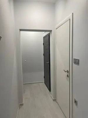 an empty hallway with a door and a closet at City Center Apartment 2 in Varna City