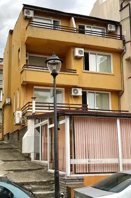 a street light in front of a building at Orange House in Sozopol