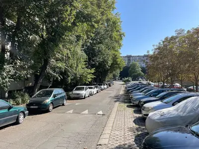 a row of parked cars in a parking lot at Sunny Seaside Retreat in Burgas in Burgas City