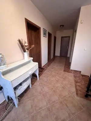 a hallway with a white piano in a room at Къща Каменар in Pomorie