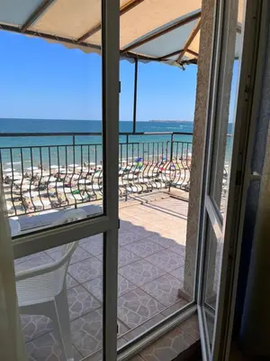 a room with a view of the beach from a balcony at Hotel Star in Sunny Beach