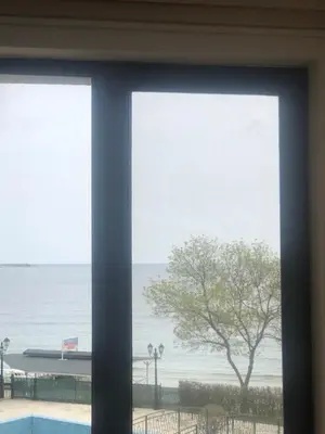 a view of the ocean from a window at Комплекс Рич 2 in Ravda
