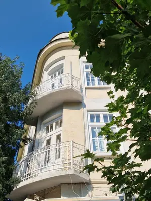 a building with balconies on the side of it at Lambo's Corner Varna - Guest Rooms in Varna City