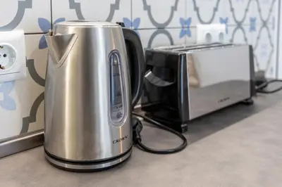 a toaster and a microwave on a counter at Roman Thermae Central Studio in Varna City