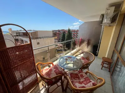 a balcony with chairs and a table on a balcony at Alexandr apartments Vigo Nesebar in Nesebar