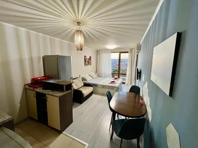 a small living room with a couch and a table at Alexandr apartments Vigo Nesebar in Nesebar