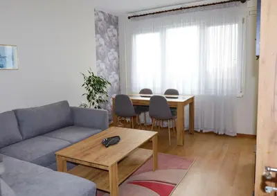 a living room with a couch and a table at Magnolia in Burgas City