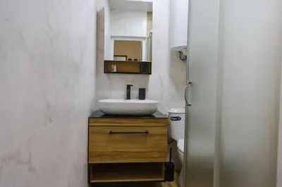 a bathroom with a sink and a toilet at Magnolia in Burgas City