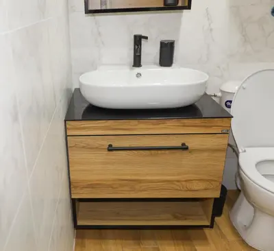 a bathroom with a sink and a toilet at Magnolia in Burgas City