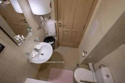 a small bathroom with a sink and a toilet at Kalia apartment in Sunny Beach