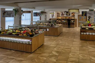 a buffet line with many different types of food at Asteria Family Sunny Beach - Ultra All Inclusive in Sunny Beach