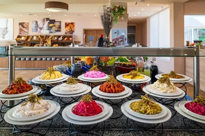 a buffet of different types of desserts on plates at Asteria Family Sunny Beach - Ultra All Inclusive in Sunny Beach