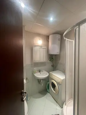 a small bathroom with a toilet and a sink at Aurelia Residences in Ravda