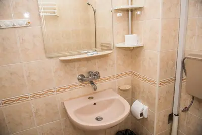 a bathroom with a sink and a toilet at Стаи за гости in Varna City