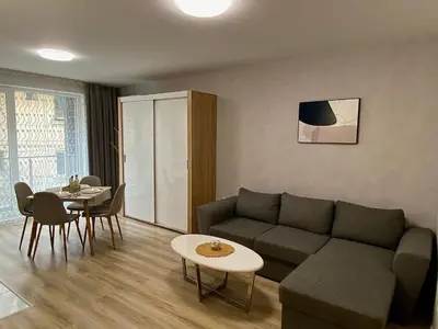 a living room with a couch and a table at AVRORA SUITE in Varna City