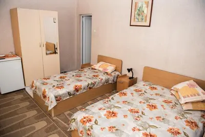 a bedroom with two beds in a room at Hotel Relax in Varna City