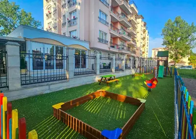 a playground in front of a building at Avenue Deluxe Hotel in Sunny Beach