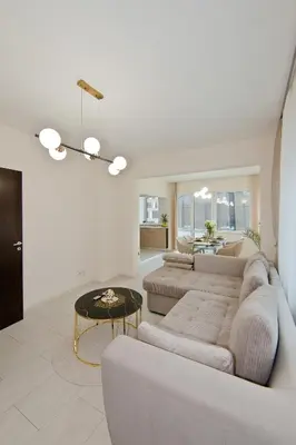 a living room with a couch and a table at Festival and Congress Centre Appartment Varna in Varna City