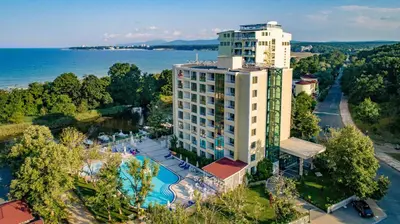 an aerial view of a tall building with a pool at Perla Royal Hotel - All Inclusive in Primorsko