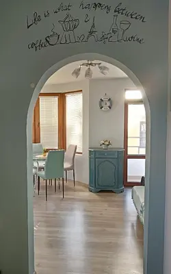 an archway in a living room with a dining room at Sea Time Burgas1 in Burgas City