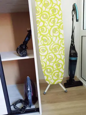 a surfboard sitting on a shelf next to a mirror at Sea Time Burgas1 in Burgas City
