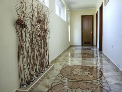 a hallway with a tile floor and a door at Elizabeth Dy Boutique Hotel in Nesebar