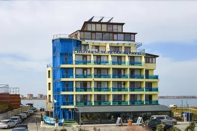 a hotel building with a sign on top of it at Petar and Pavel Hotel & Relax Center in Pomorie