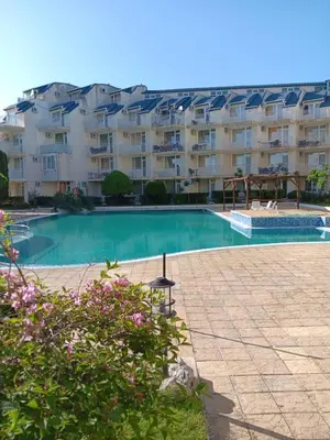 a large swimming pool in front of a building at Rutland Bay in Ravda