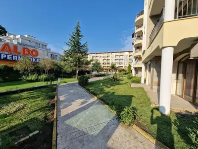 a walkway in front of a building at Menada Royal Dreams Apartments in Sunny Beach